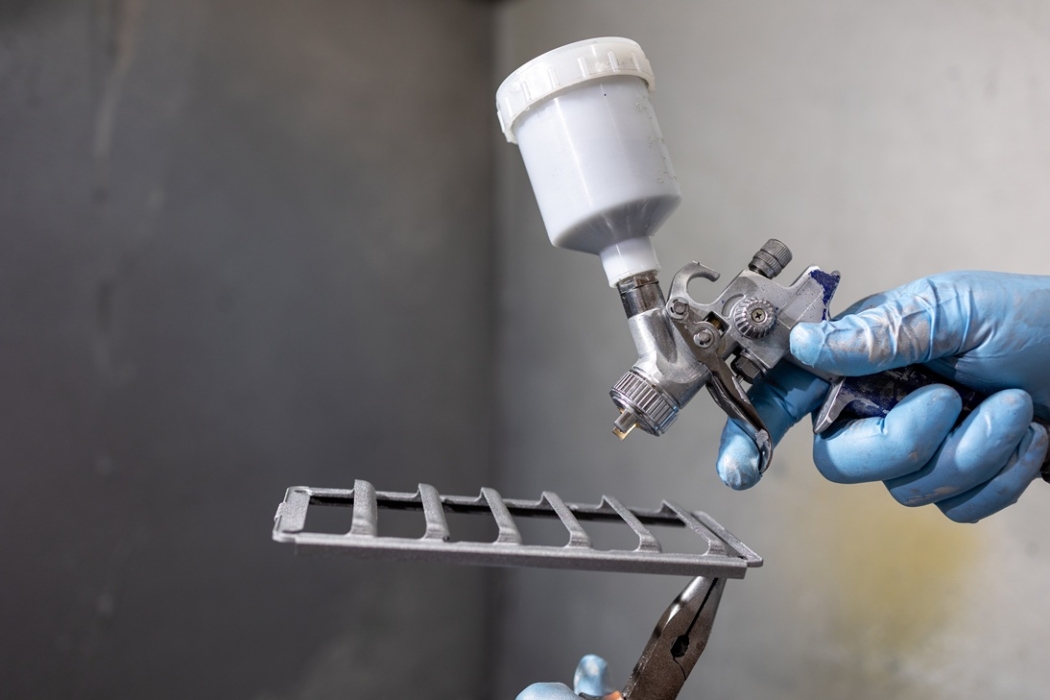 Additive manufactured component about to be spray painted Additive manufactured component about to be spray painted