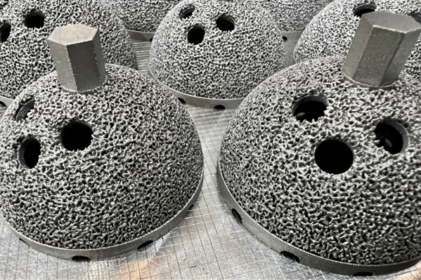 Additive manufactured hip implants