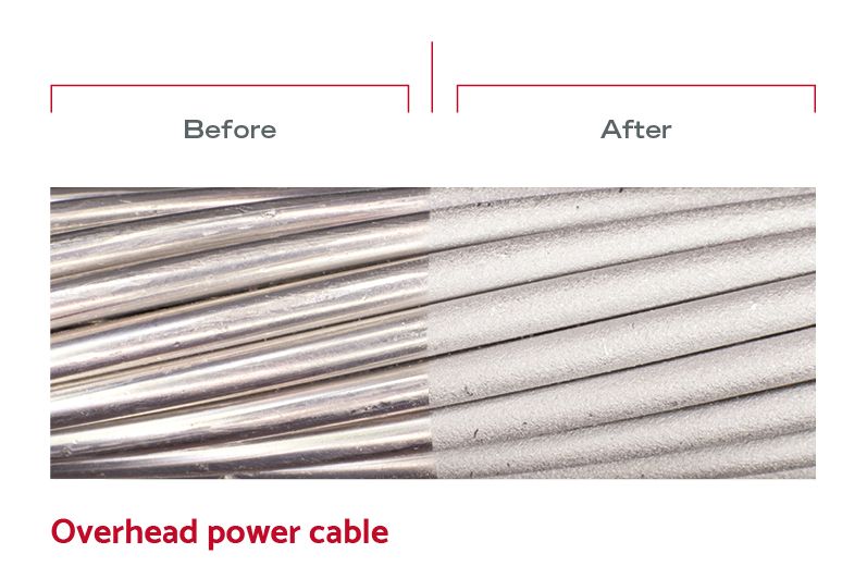Before and after image of wet blasted overhead power cable