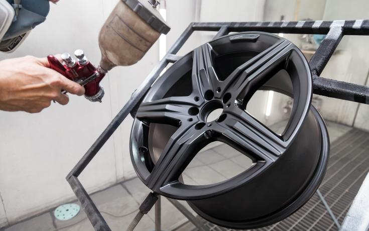 Alloy wheel being painted