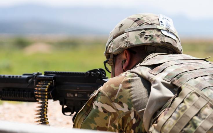 Automatic weapon being fired by a solider