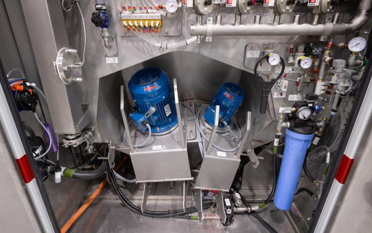 Inside the maintenance cabinet of a Vapormatt Sabre automatic wet blasting machine