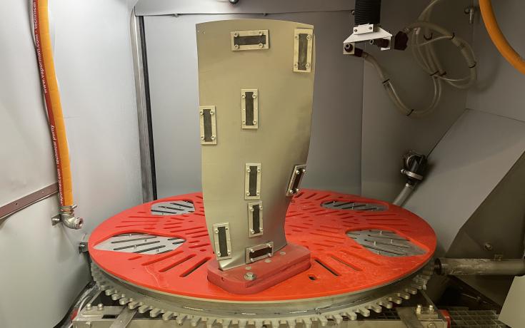 Titanium fan blade in a Cougar Vertical with Almen strips attached