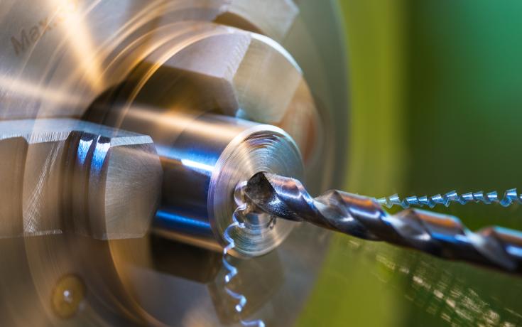 Drill drilling into metal