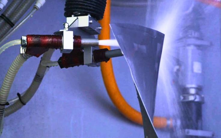 Jet engine fan blade being wet peened in a Vapormatt Cougar+ automatic wet blasting machine