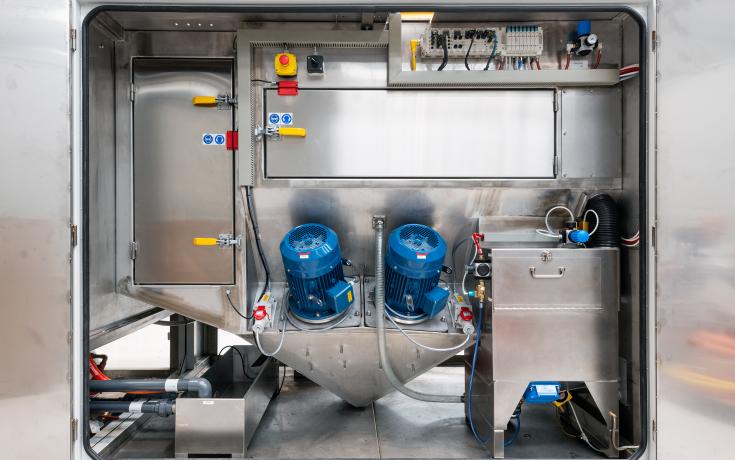 Dual powerful pumps within a Vapormatt Tiger automatic wet blasting machine