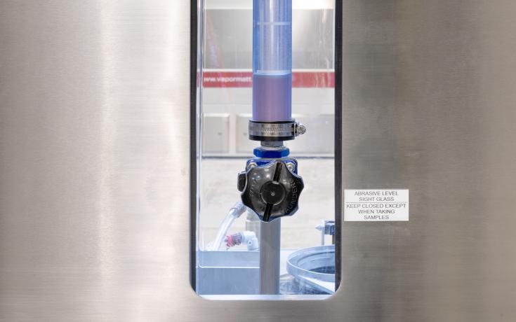 Sight glass for measuring blast media concentration levels