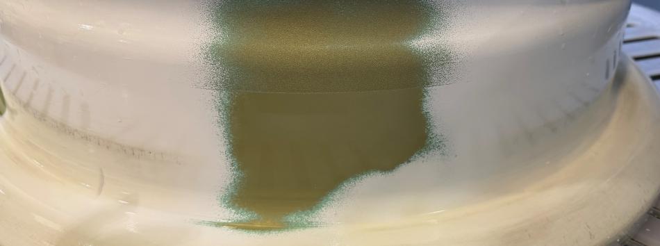 Aircraft wheel with paint partially stripped
