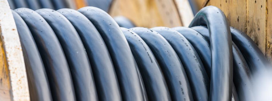 Encapsulated cable on reels