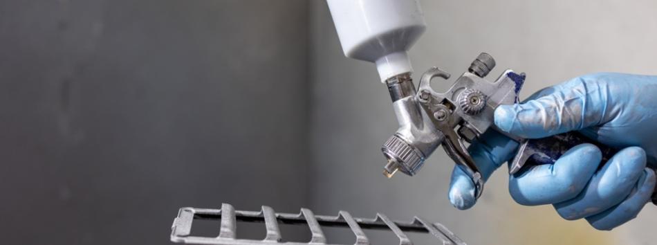 Additive manufactured component about to be spray painted