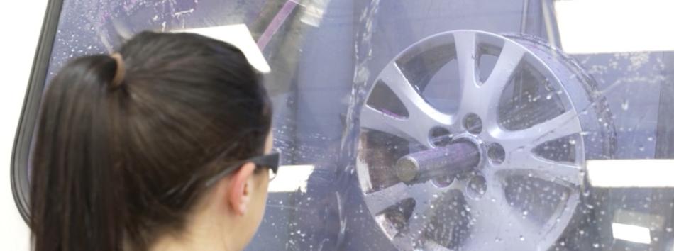 Wet blasting an alloy wheel