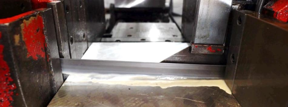 Bandsaw blade cutting metal