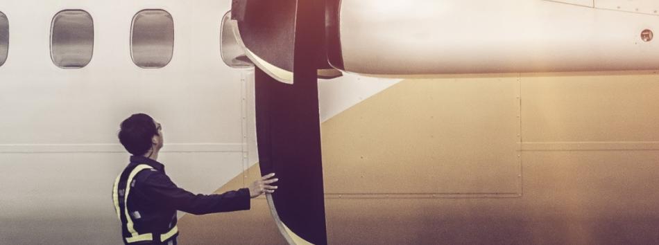 Person inspecting a composite propeller
