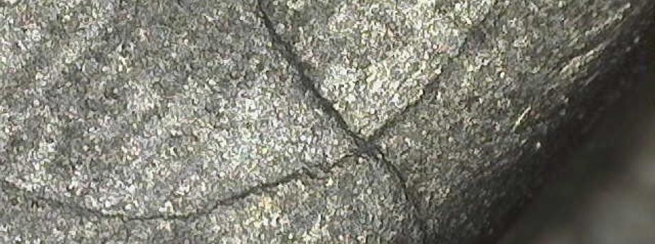 Microscopic crack in aircraft component after being cleaned out by wet blasting
