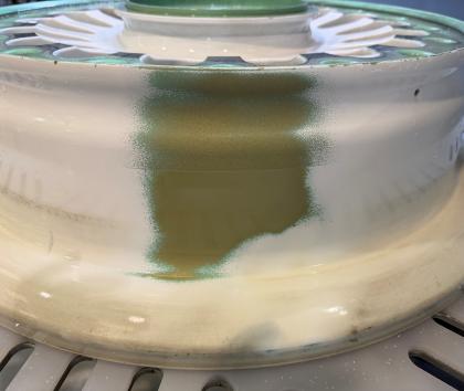 Aircraft wheel with paint partially stripped