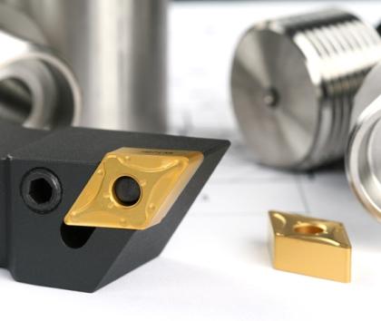 Cutting tool insert with a honed and coated cutting edge