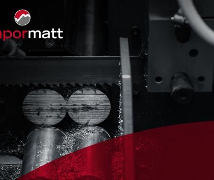Image of wet-blasted bandsaw blades cutting through metal rods.
