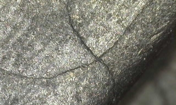 Microscopic crack in aircraft component after being cleaned out by wet blasting