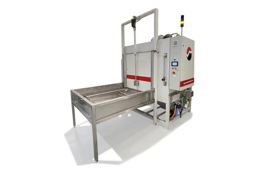 Vapormatt Cougar+ wet-blasting system configured with single load end and powered vertical door