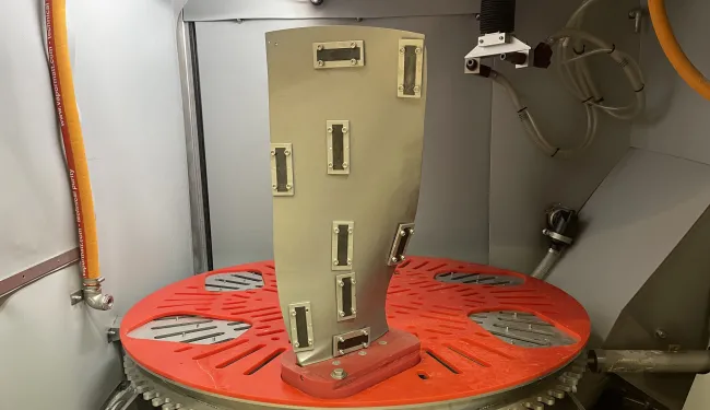 Jet engine fan blade with Almen strips attached