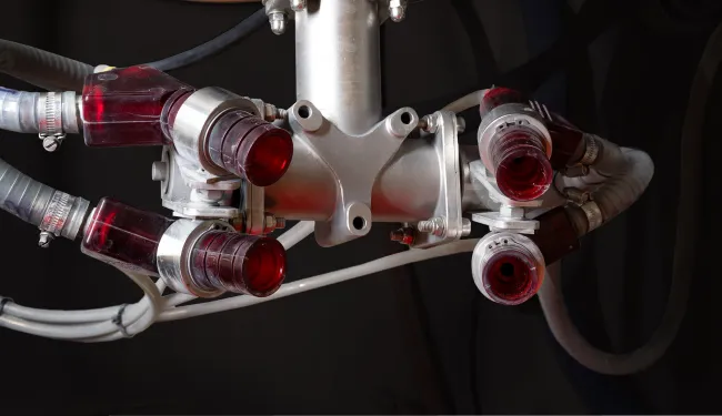 Multiple Vapormatt blast guns on a robotic arm