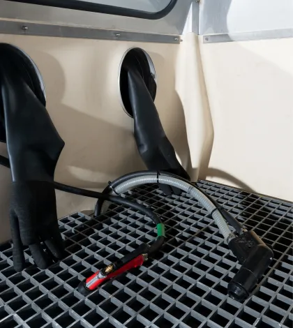 Gloves, blast, rinse, and air guns in a Vapormatt Puma manual wet blasting machine