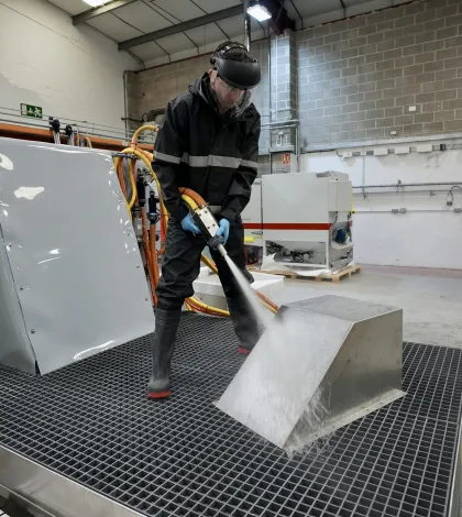 Blasting a component on a Leopard Sump wet blasting machine