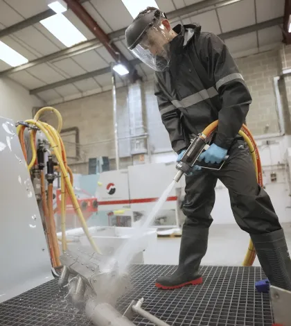 Blasting a component on a Leopard Sump wet blasting machine