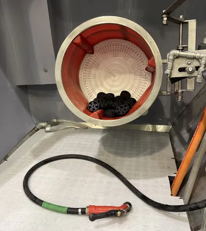 Vapormatt Puma+ automatic wet blasting machine fitted with a barrel for processing smaller components including additive manufactured components