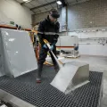 Blasting a component on a Leopard Sump wet blasting machine