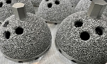 Additive manufactured hip implants